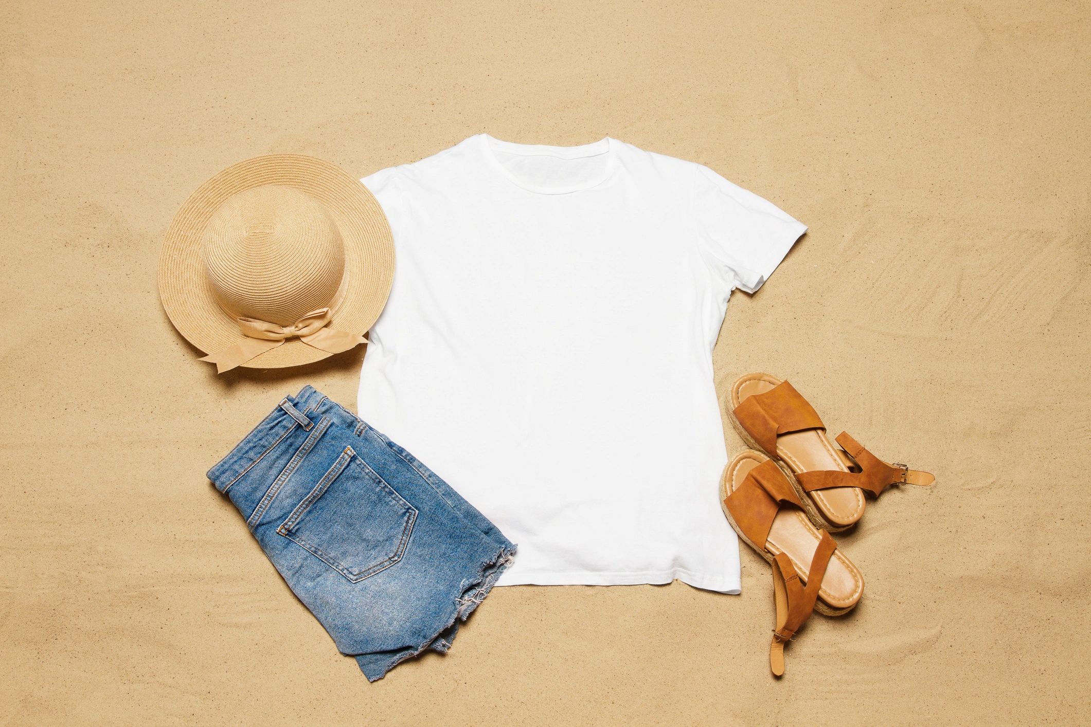 White t-shirt beach flat lay used as a testimonial avatar image